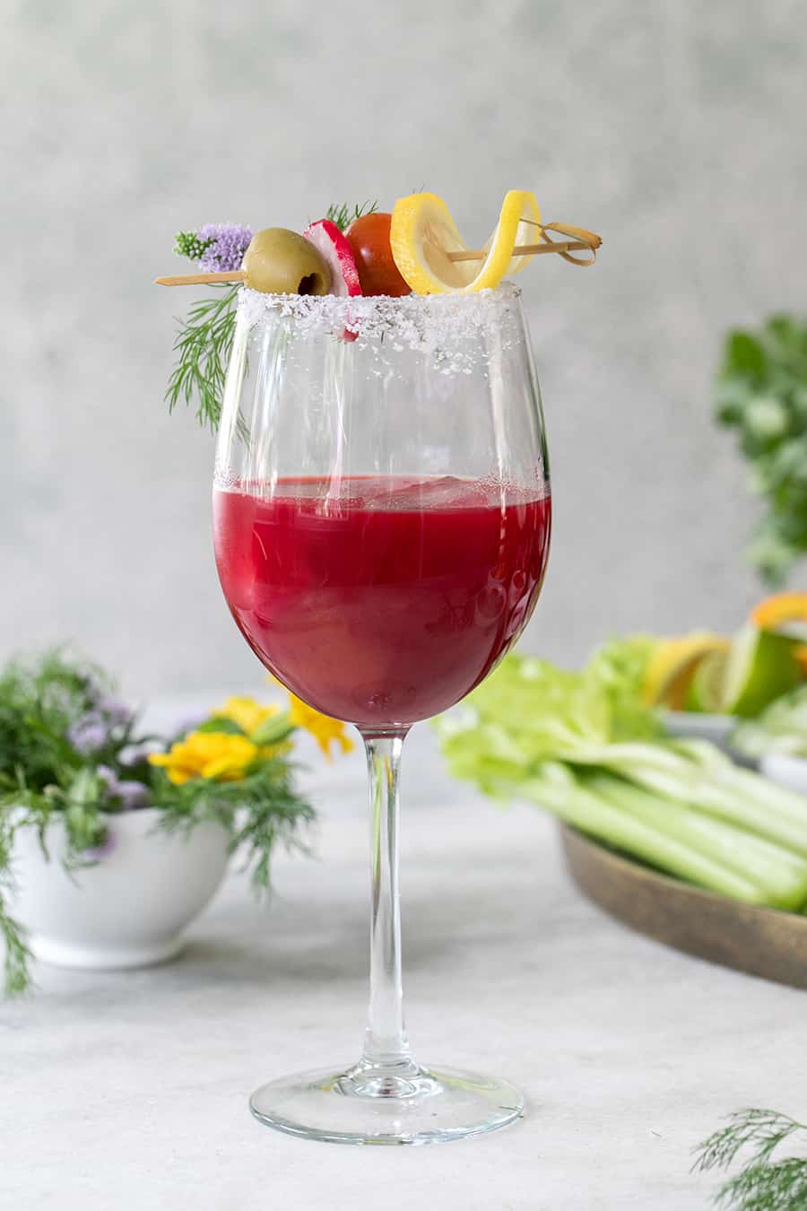 Beet juice bloody mary in a wine glass