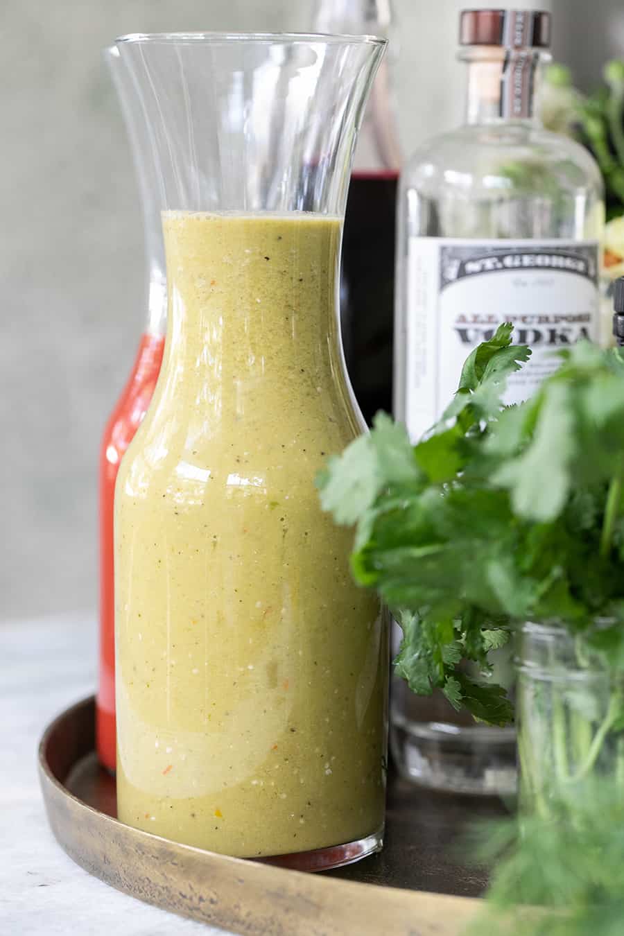 Tomatillo bloody Mary mix in tall glass.