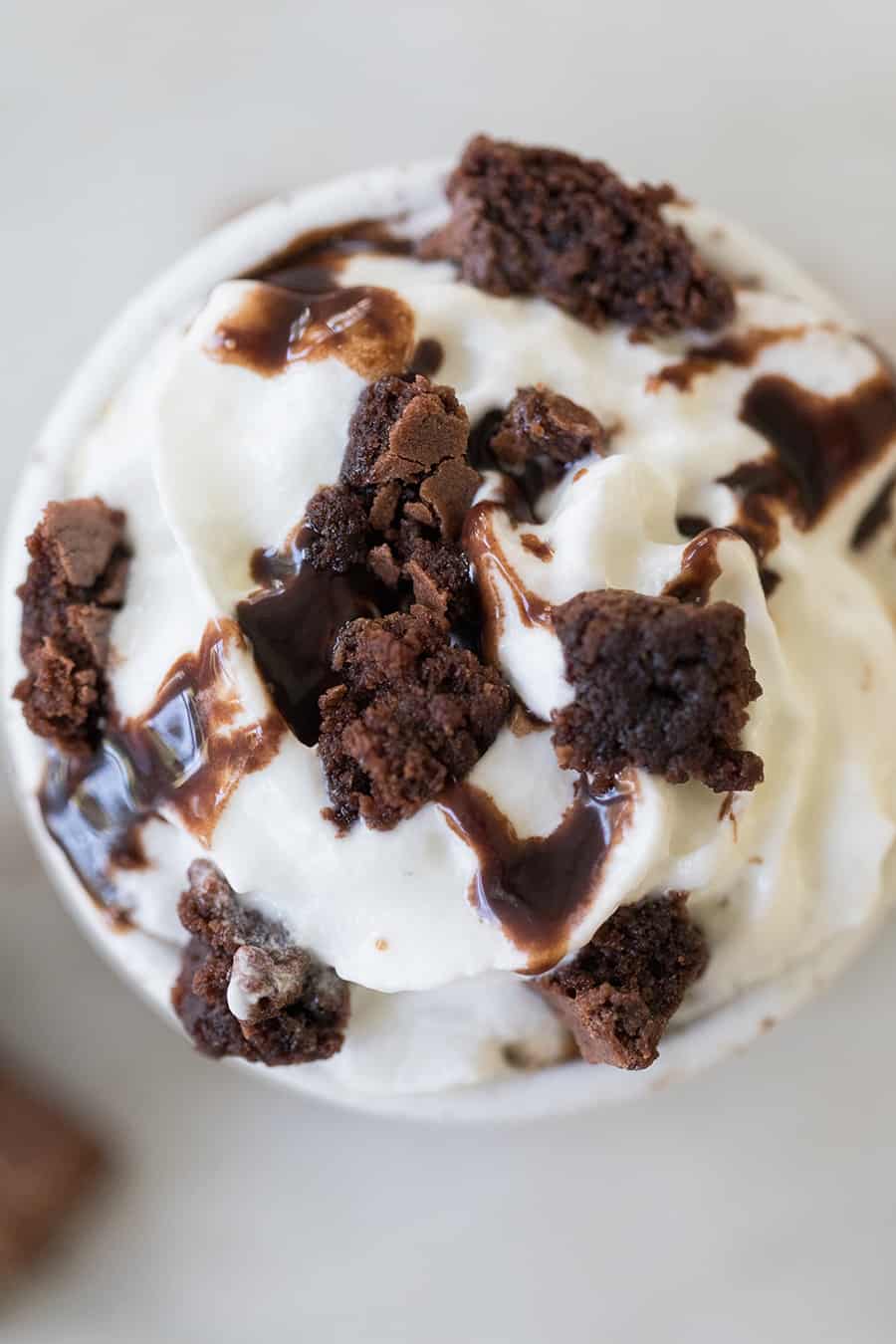 close up overhead shot of caramel coffee topped with whipped cream