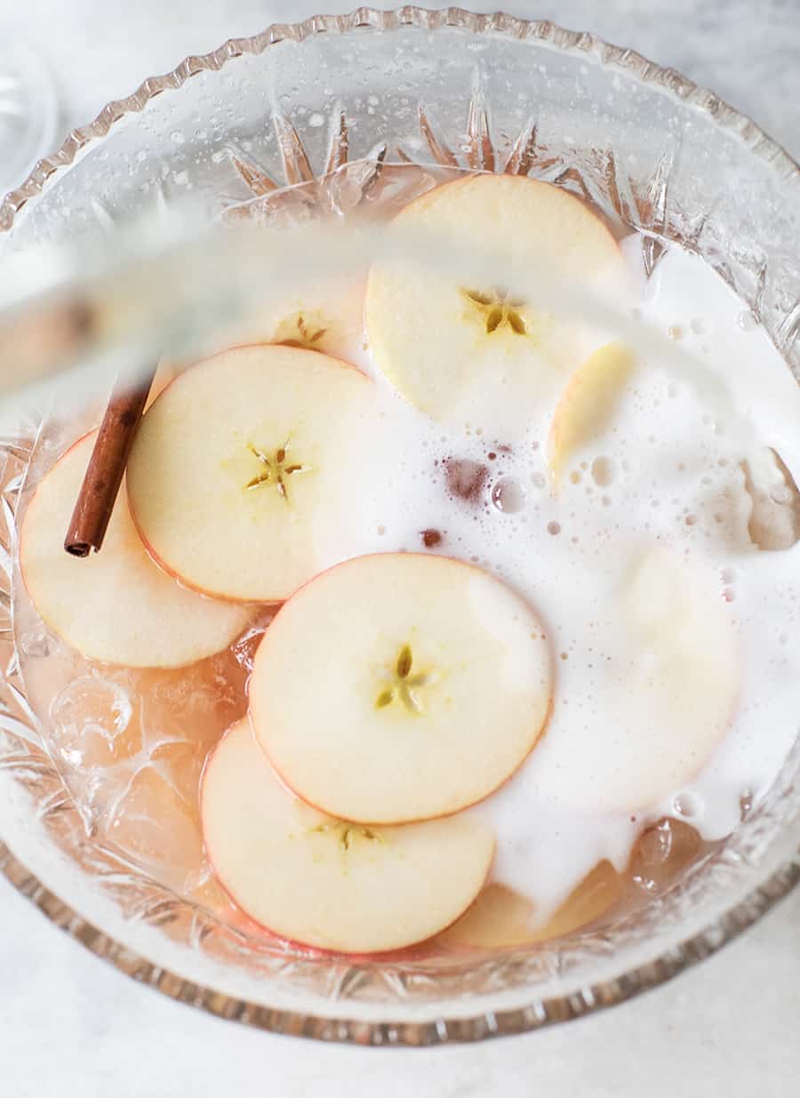 Sparkling holiday punch with vodka and apples and cinnamon. 
