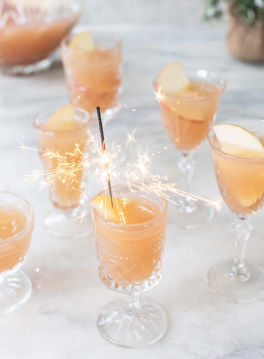 Sparkling cocktail in glasses with sparklers.