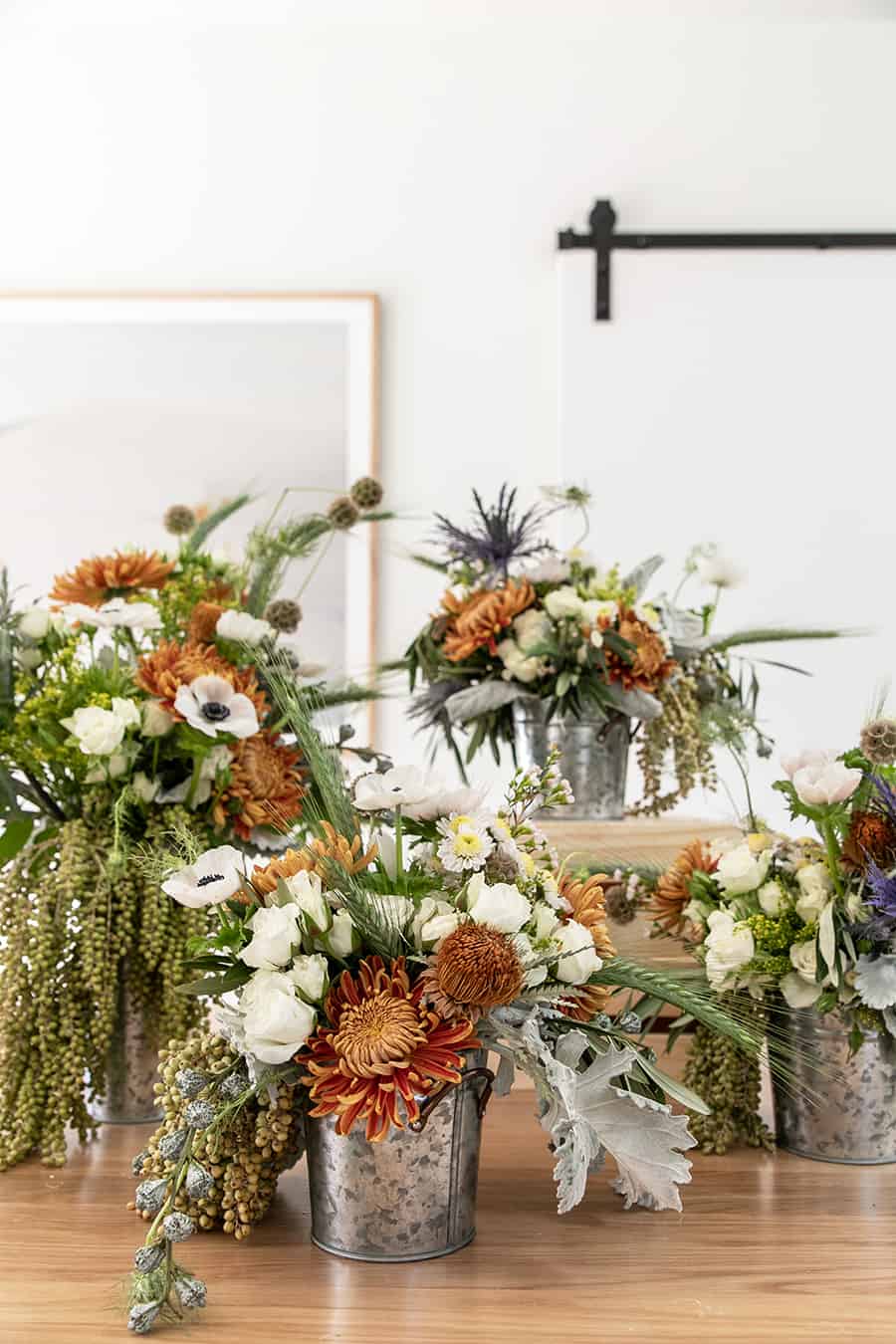 flowers in a galvanized bucket for a barnyard birthday party 