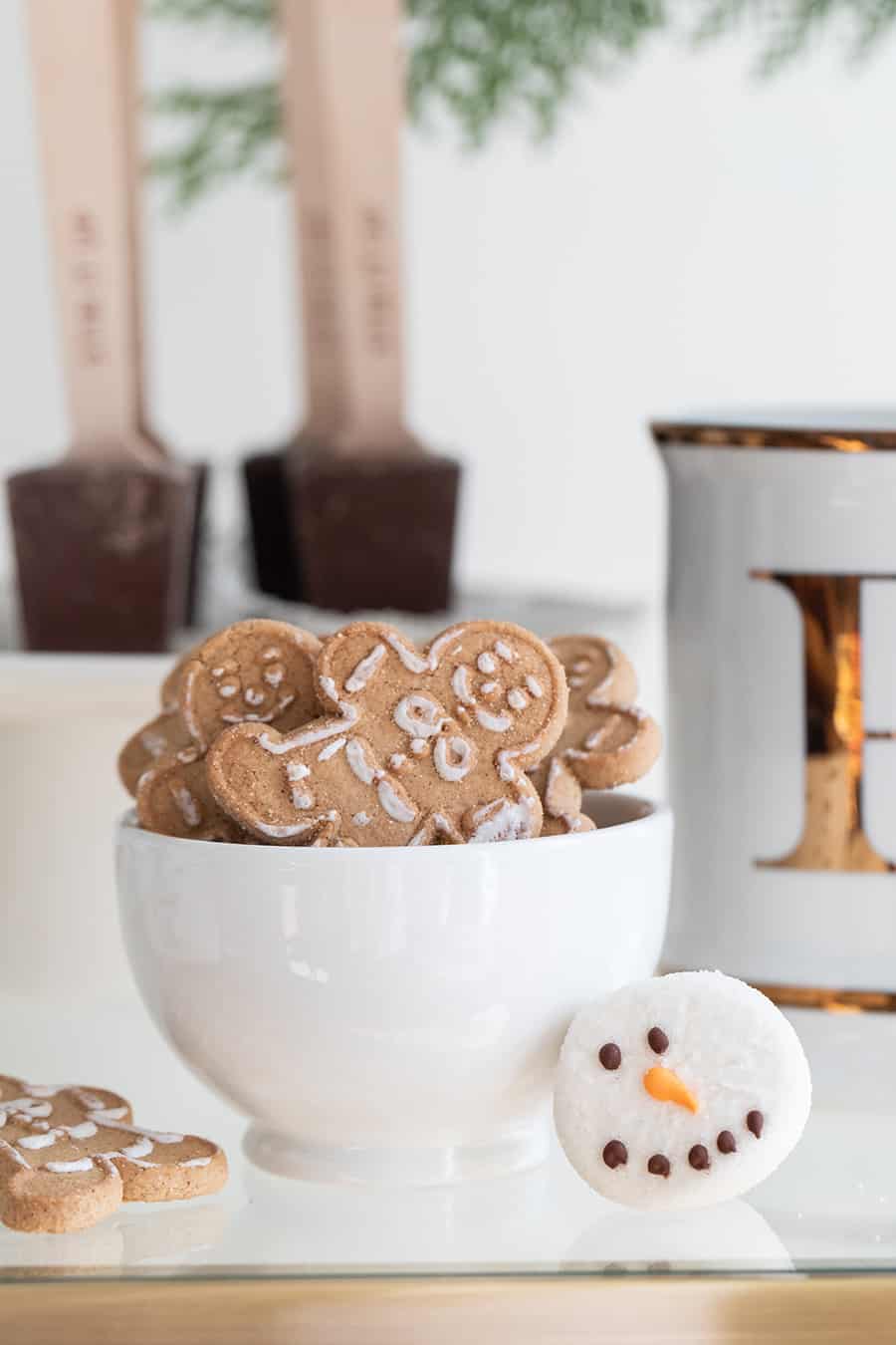 Gingerbread cookies in a small white bowl.