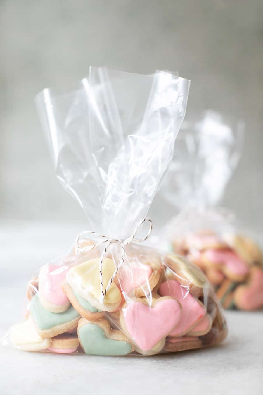 mini heart shaped sugar cookies in a plastic bag to give as a Valentine's Day gift