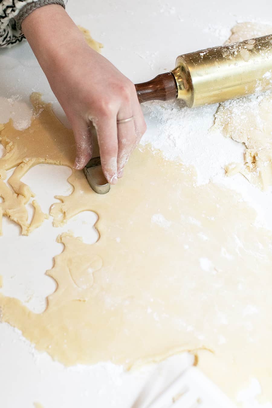 rolling dough for cut out heart shaped sugar cookies