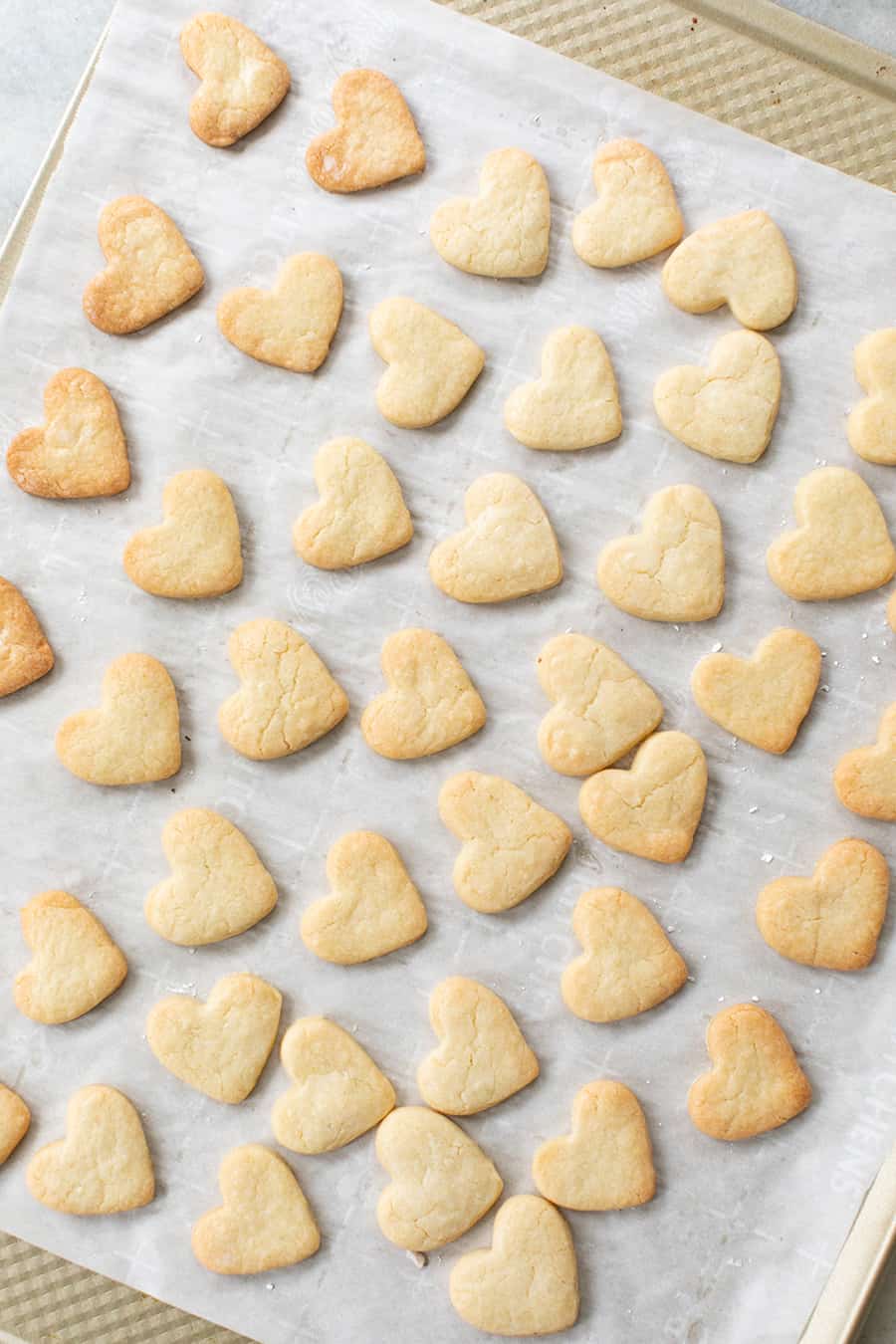 cut out heart shaped sugar cookies right out of the oven before frosted