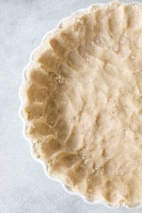 Shortbread pie crust pressed into a pie dish