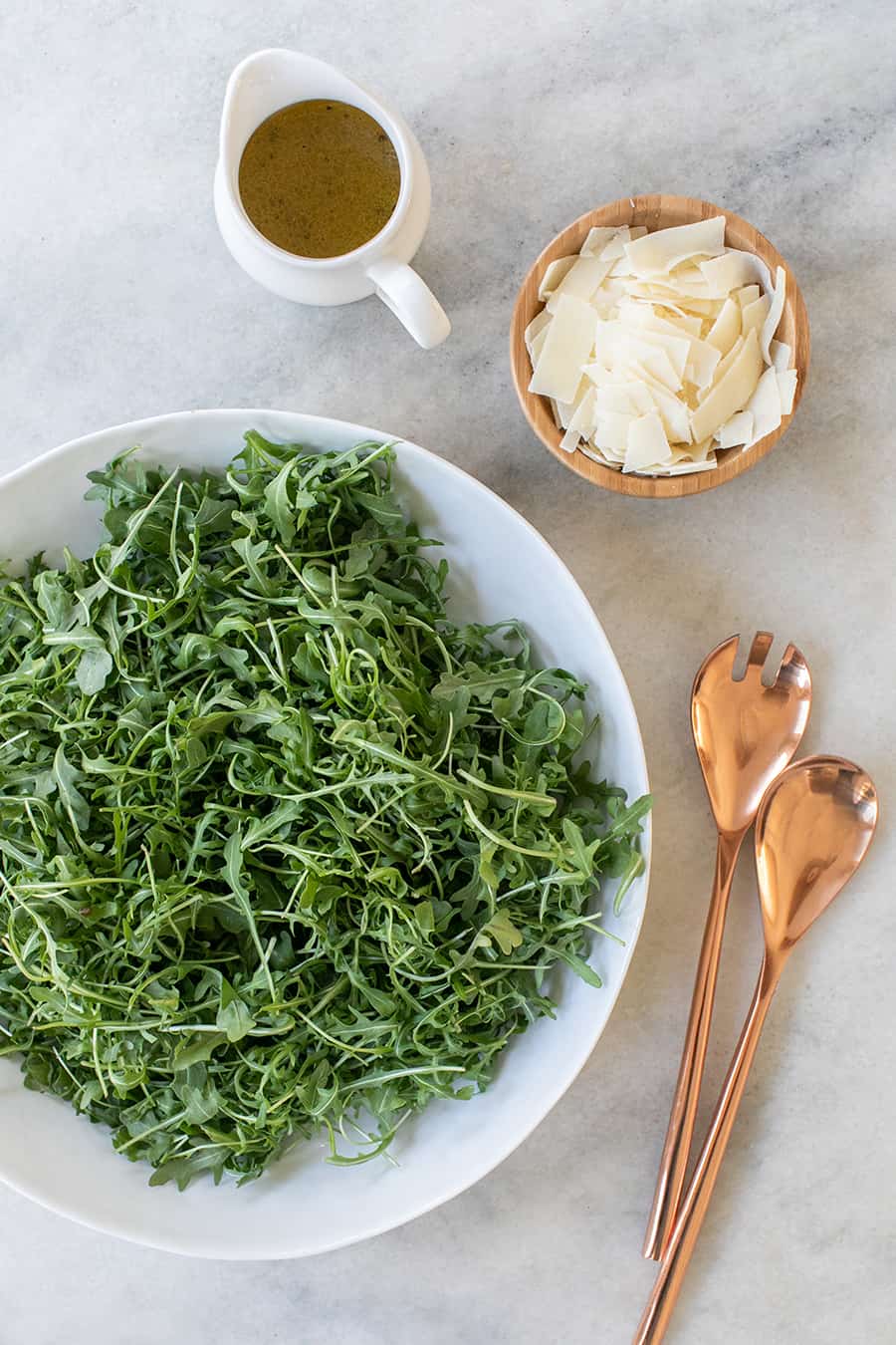 ingredients in a salad arugula and parmesan