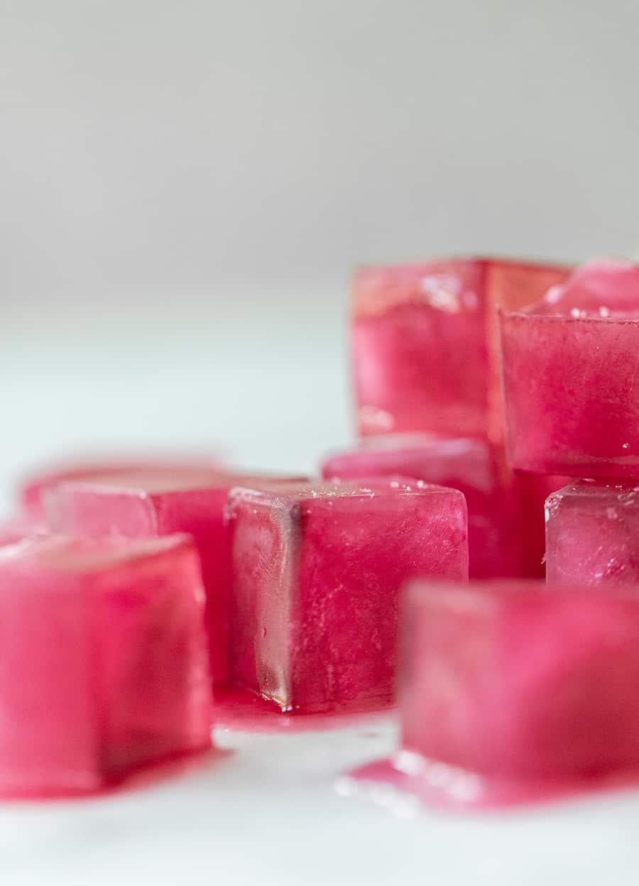 pink ice cubes made with hibiscus flowers