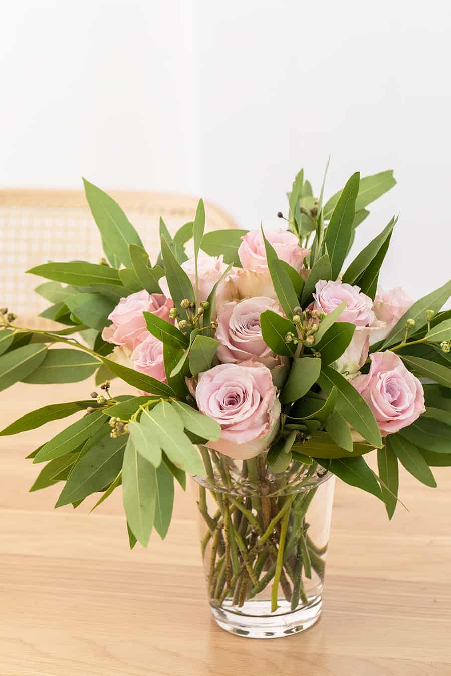 side shot of pink roses in a vase