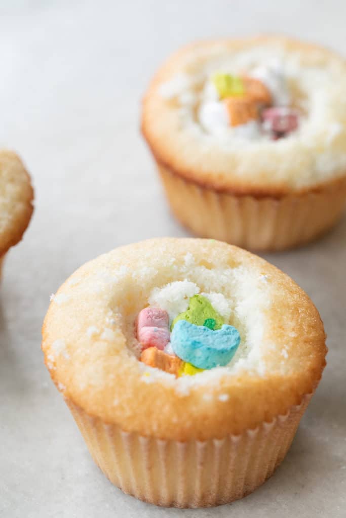 Lucky Charms Cupcakes filled with marshmallow fluff.