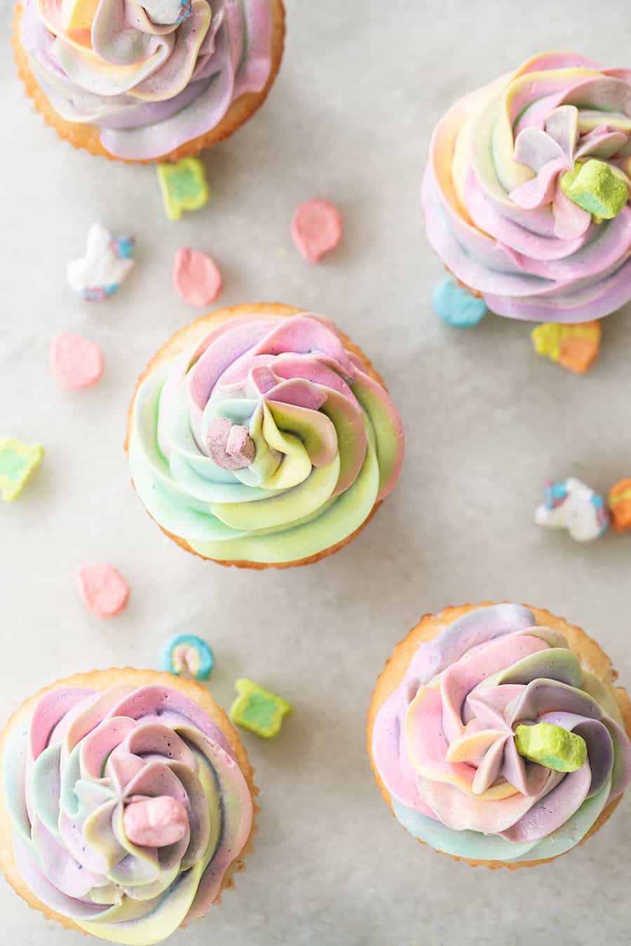 Rainbow buttercream frosting on Lucky Charms Cupcakes for Saint Patrick's Day.