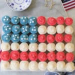 overhead photo of American flag made out of cupcakes