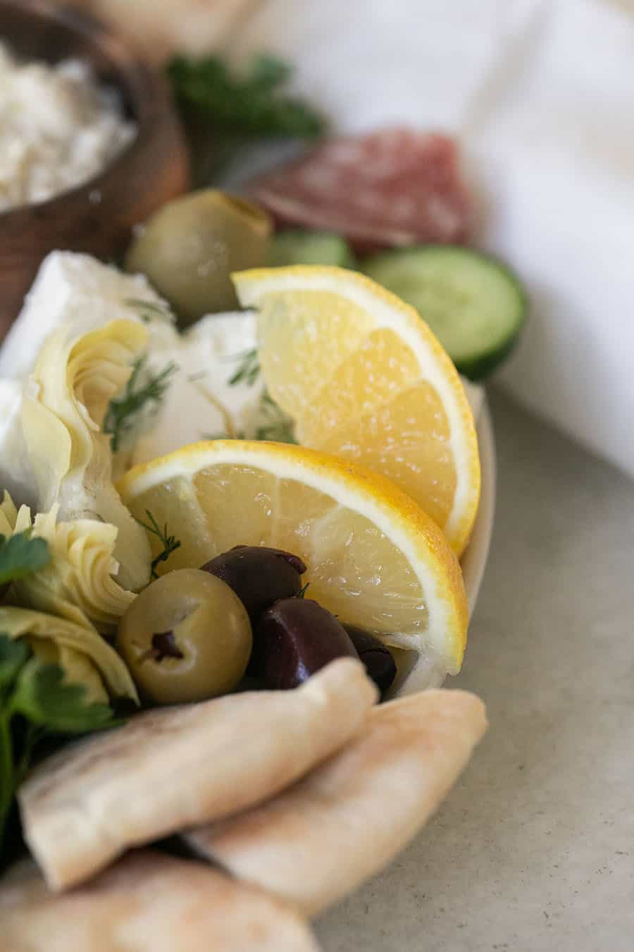 Limes and olives on a greek food platter. 