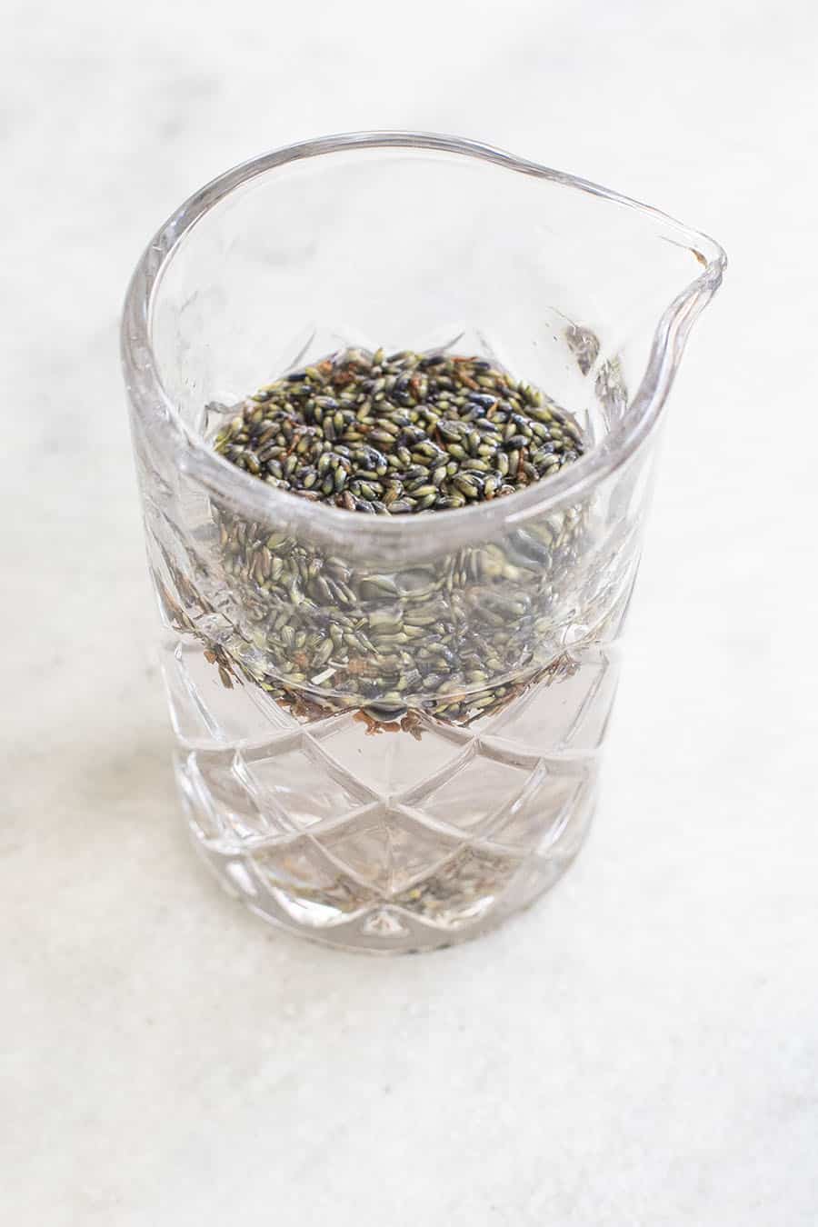 Infusing lavender with gin to make a cocktail.