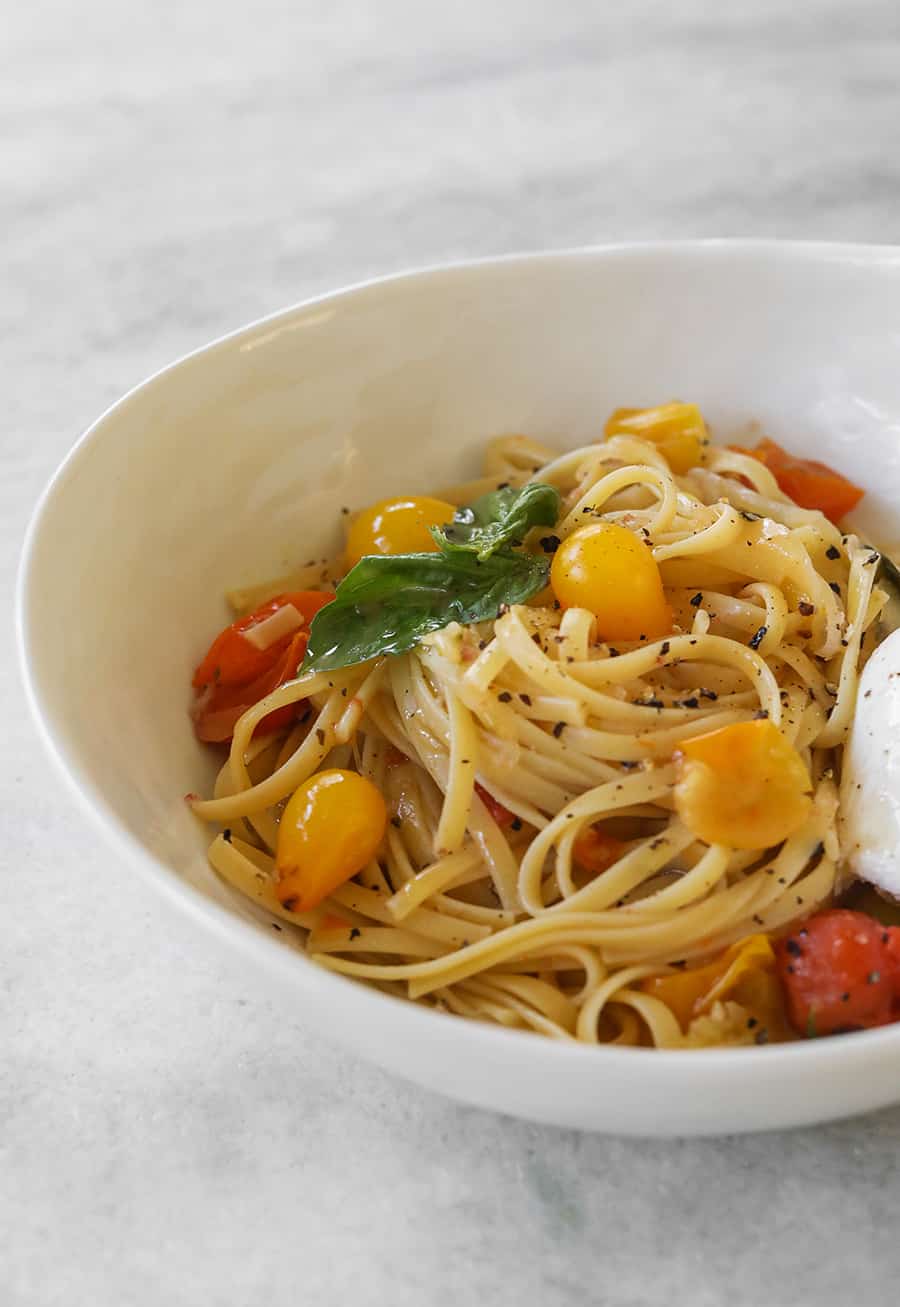 One Pan Basil and Tomato Pasta in white bowl. - tomato basil pasta