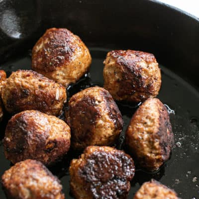 Turkey meatballs cooked in a cast iron skillet