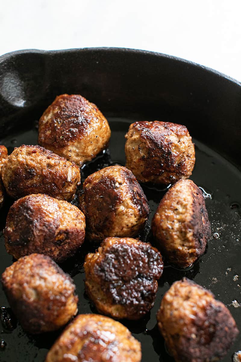 Turkey meatballs cooked in a cast iron skillet