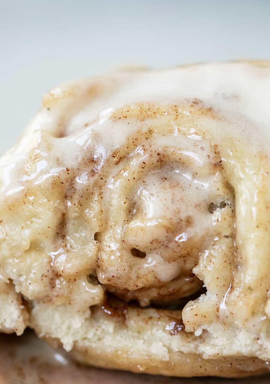 Close up photo of a moist cinnamon roll.