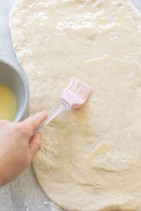 Spread butter over the rolled out dough.