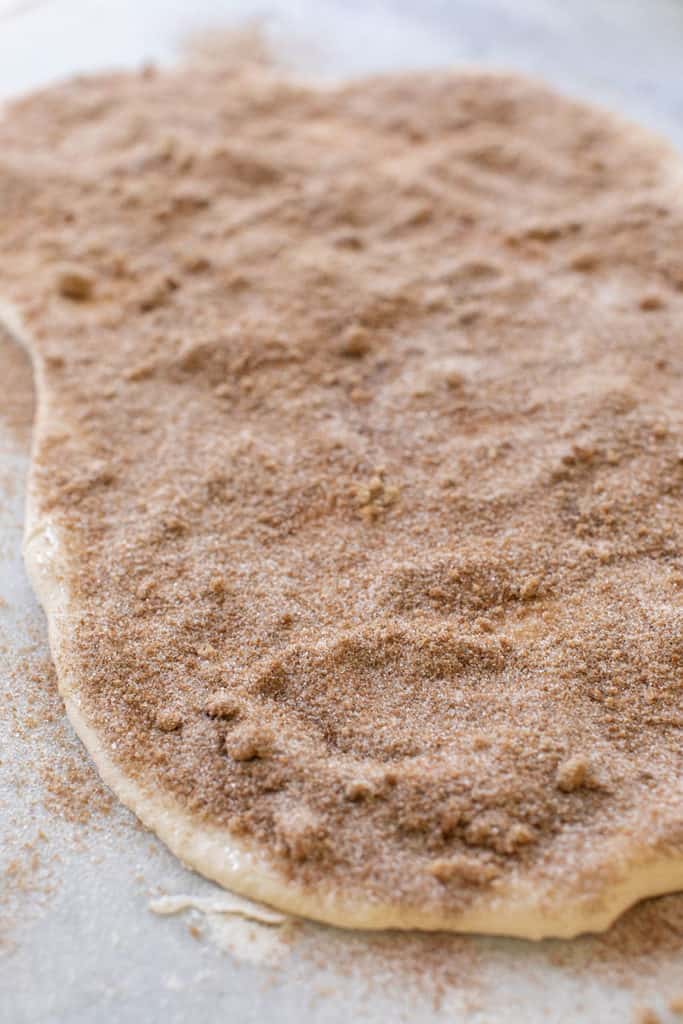 Cinnamon and Sugar Sprinkled over rolled out dough for cinnamon rolls.