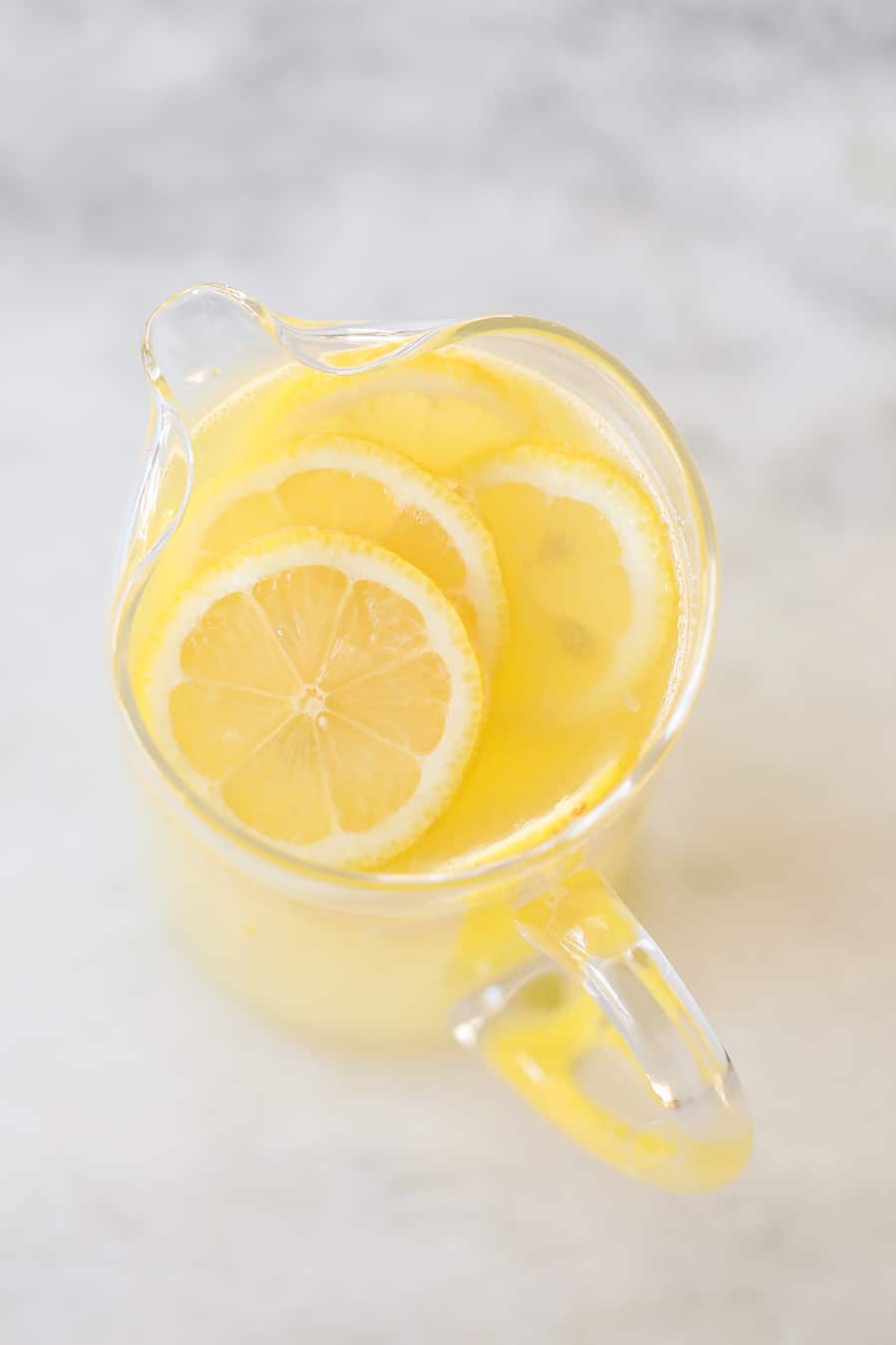 Lemonade recipe with slices of lemons.