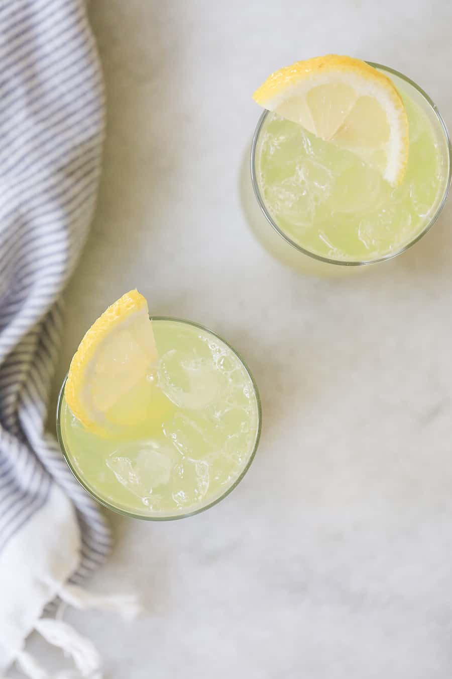 Two glass of emonade with melon juice. 