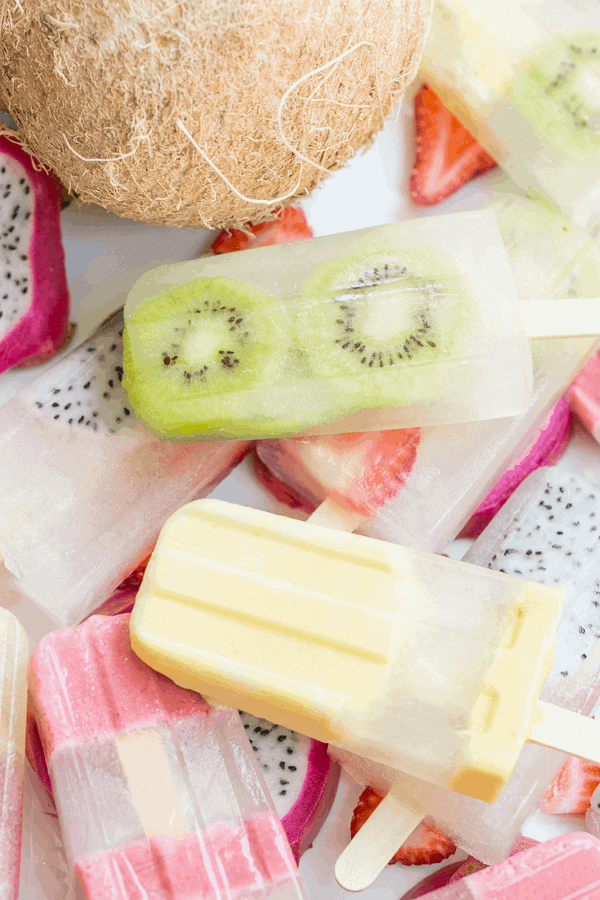 Coconut water healthy fruit homemade popsicles  popsicles overhead. - fresh strawberries