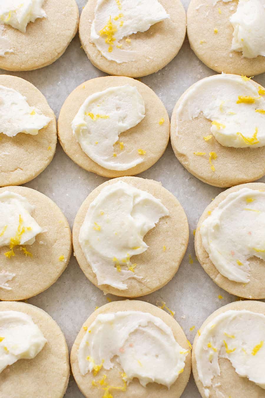 Lemon cookies with lemon frosting and lemon zest.