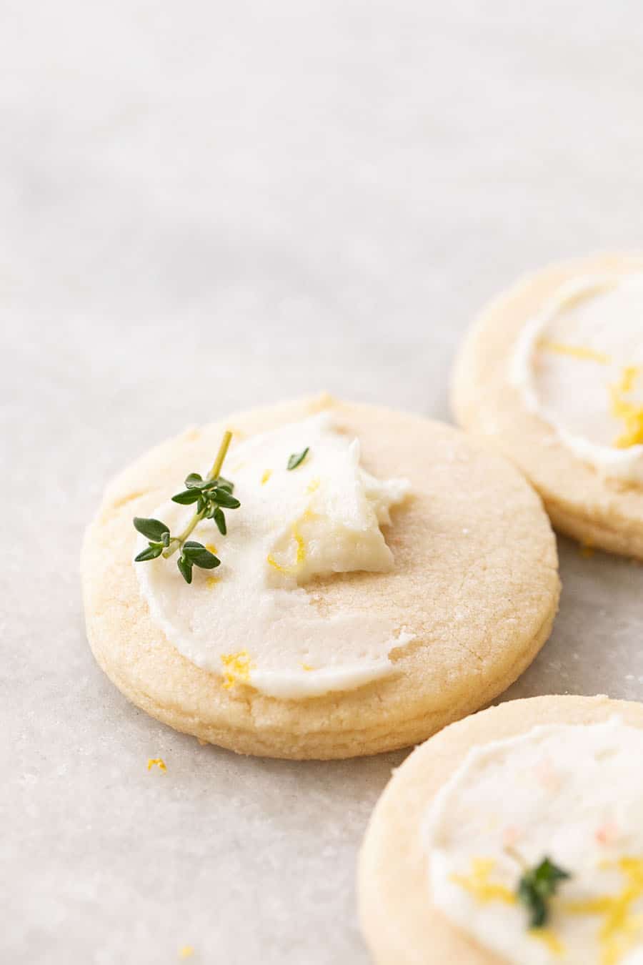 Shortbread Cookie with a little lemon frosting and a sprig of thyme.