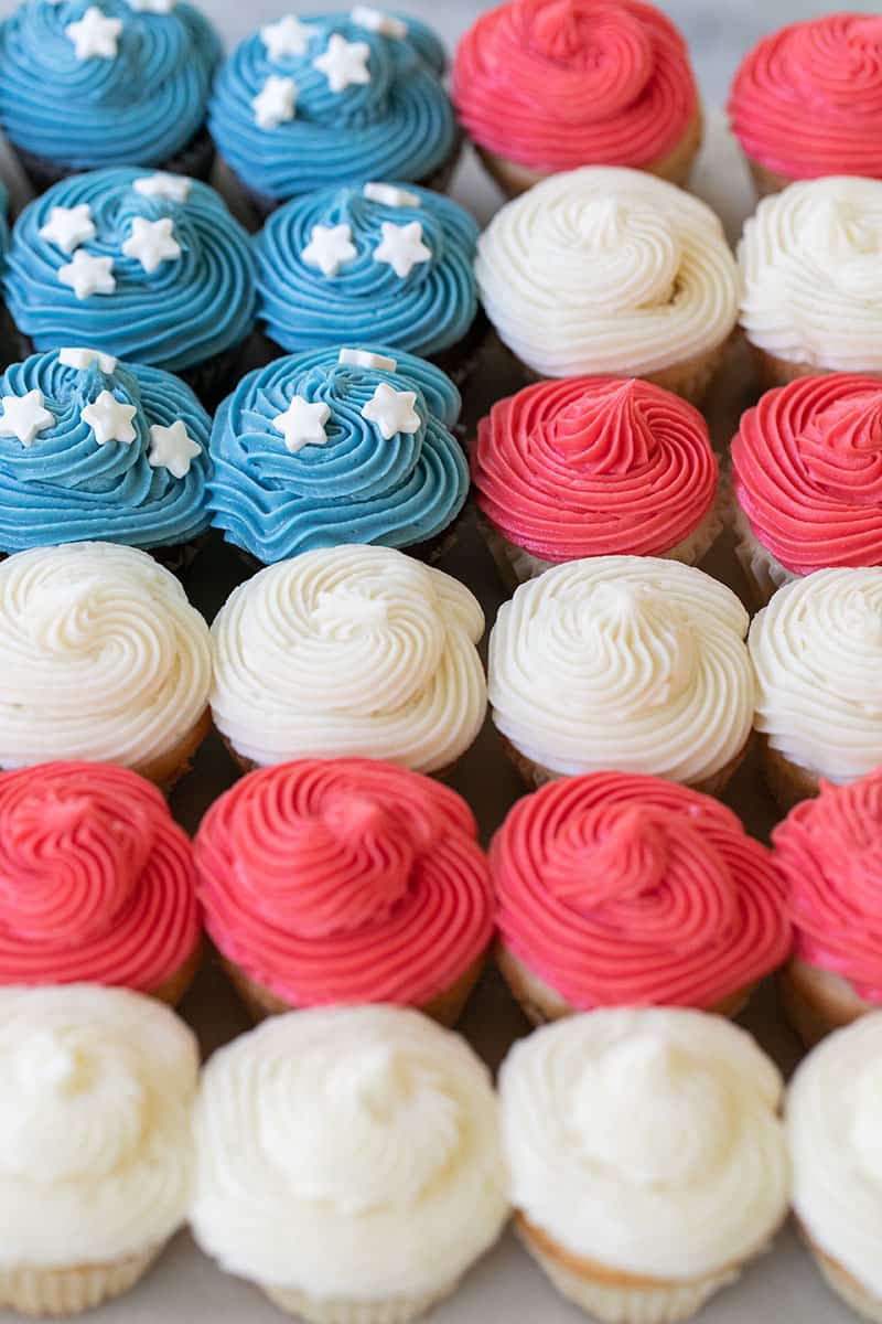 Cupcake cake in the shape of a flag with red, white blue cupcakes. 