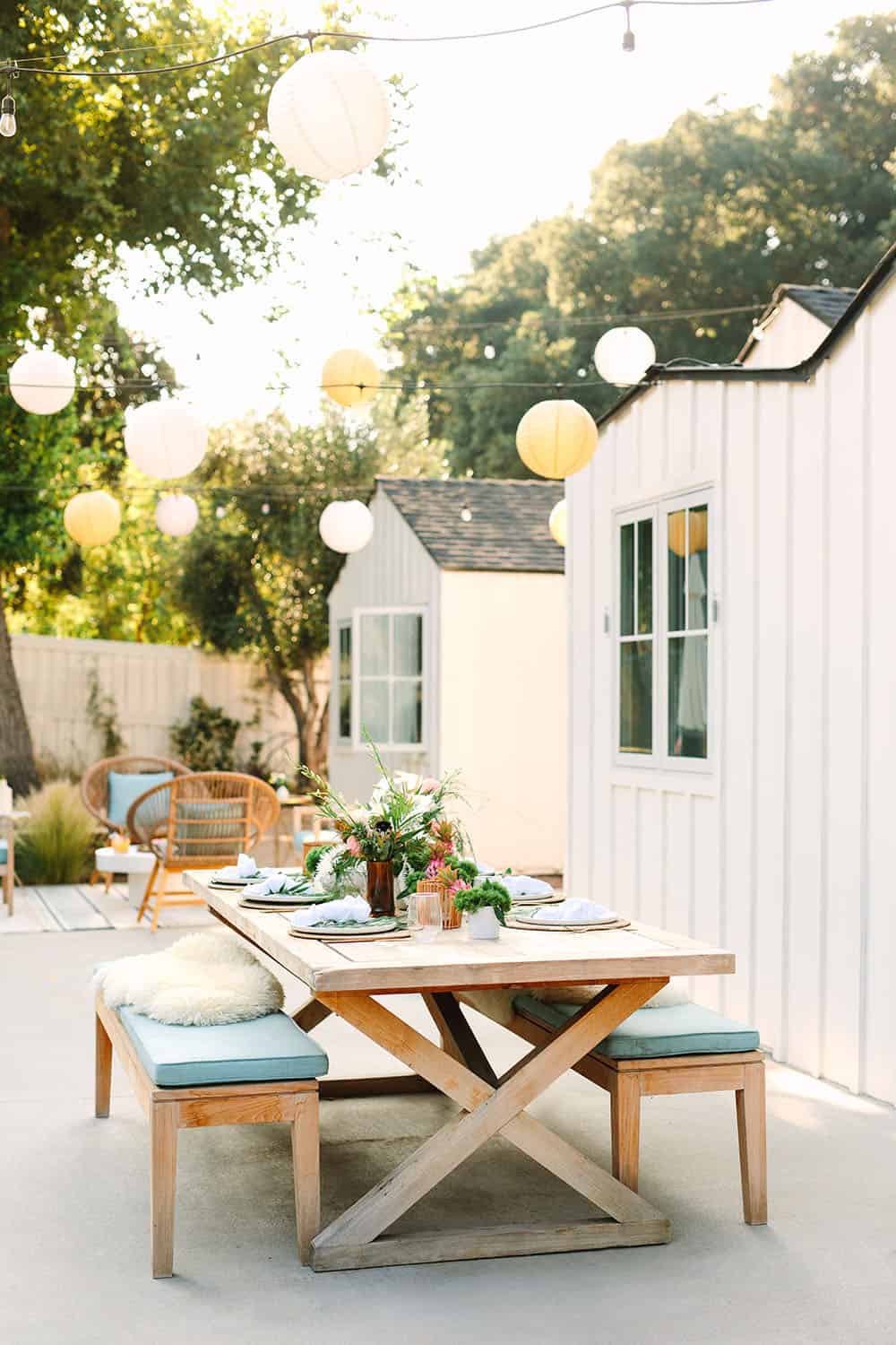 Outdoor table and party decorations for a tropical summer party.