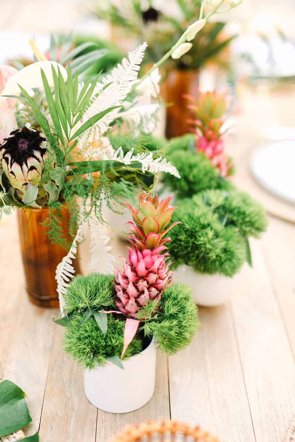 Tropical flowers and a pink pineapple for a backyard party.