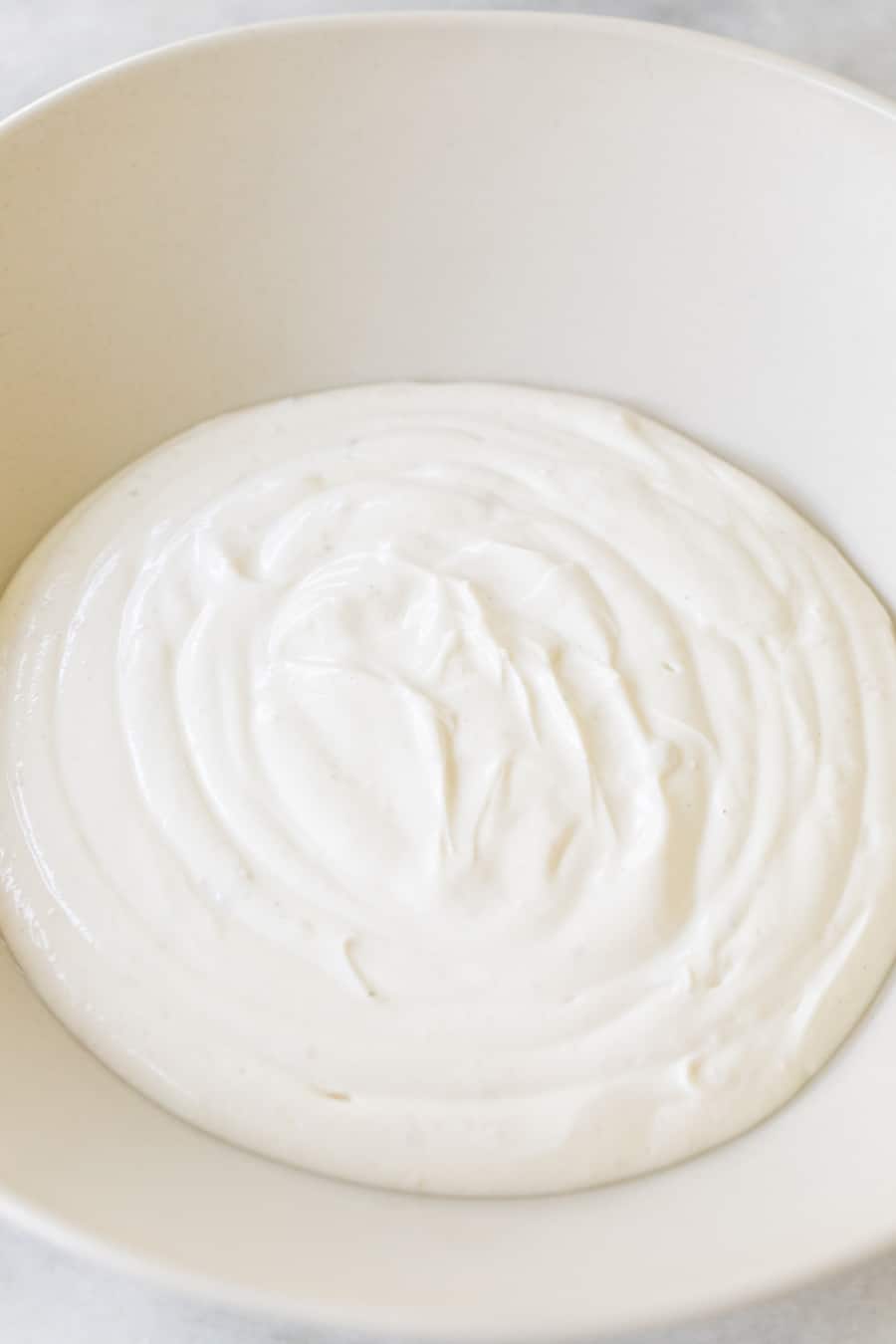 Yogurt in a white bowl.