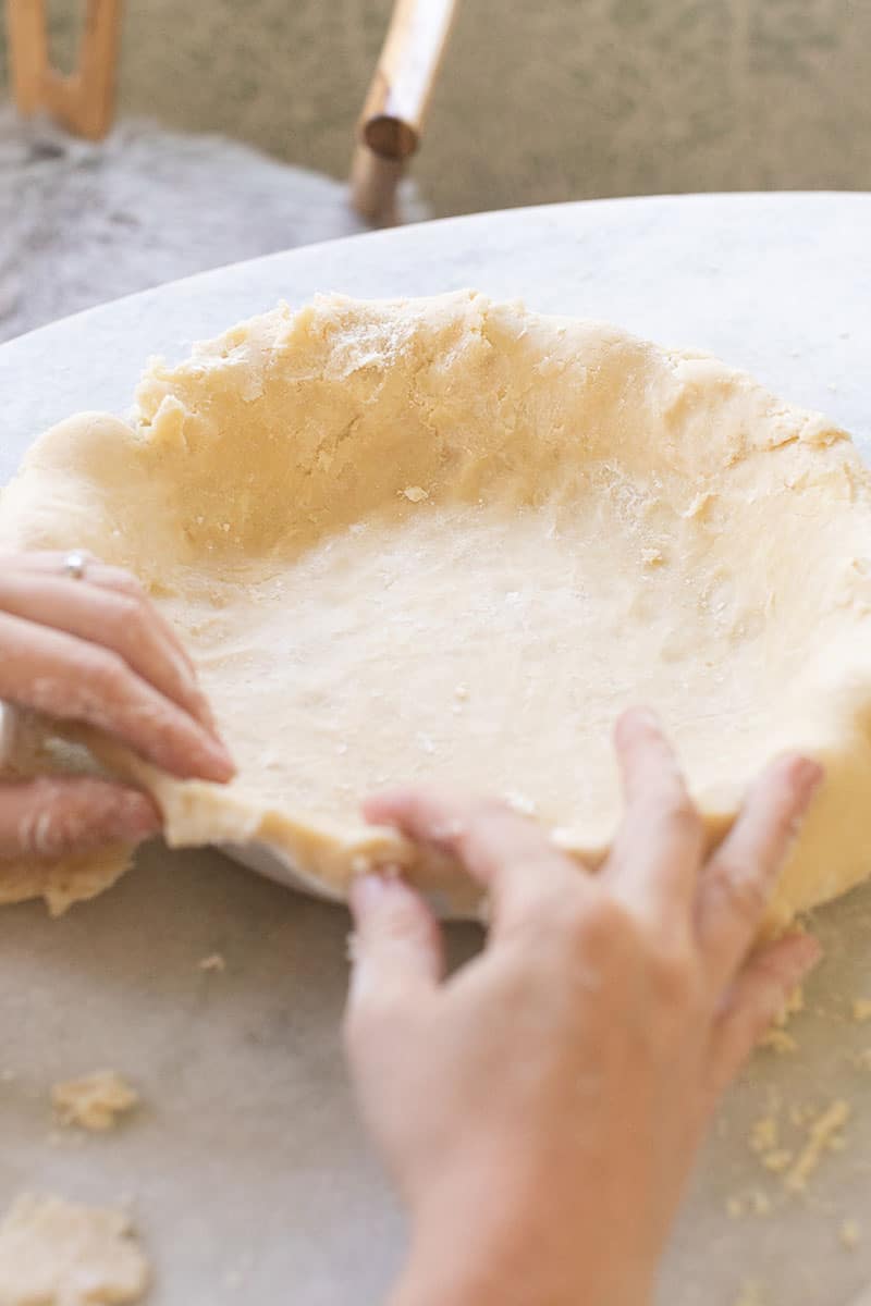 hand making the perfect pie crust 