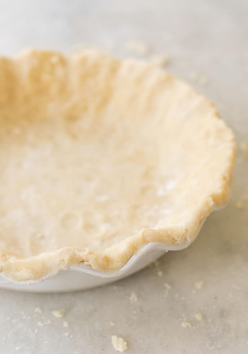 pie crust in white pie dish