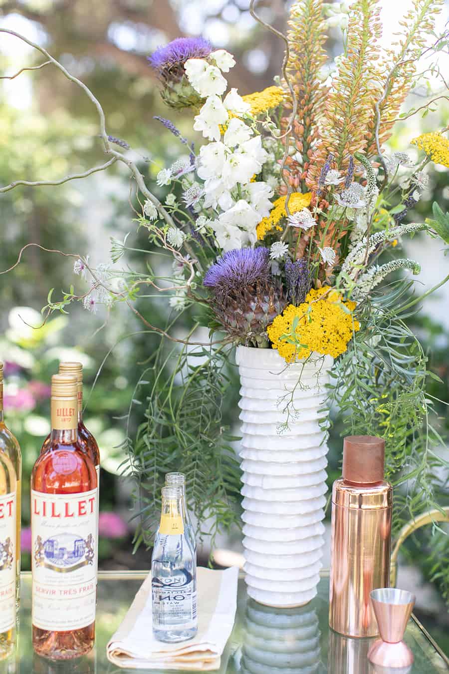 Yellow flowers and white vase.