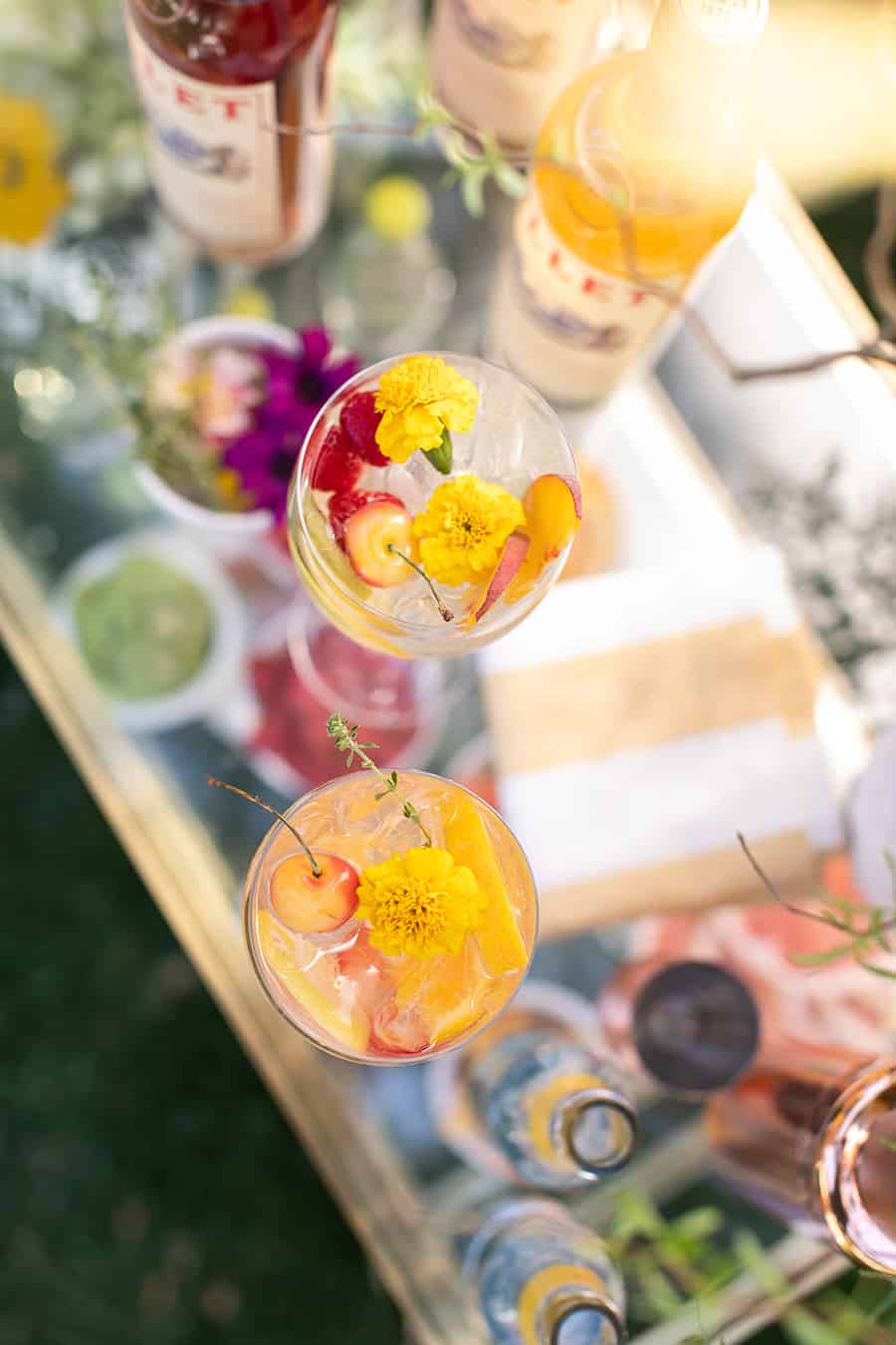 overhead on cocktail with edible flowers