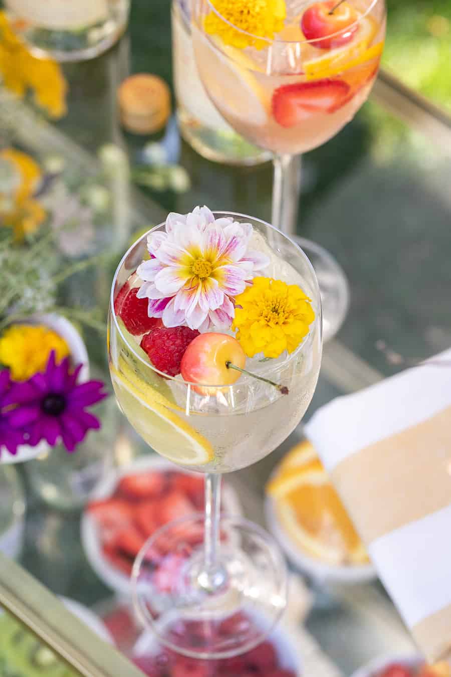 Spritzer with edible flower and cherries