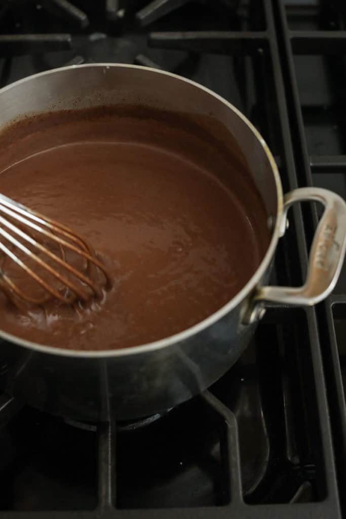 Homemade chocolate pudding on the stove top.