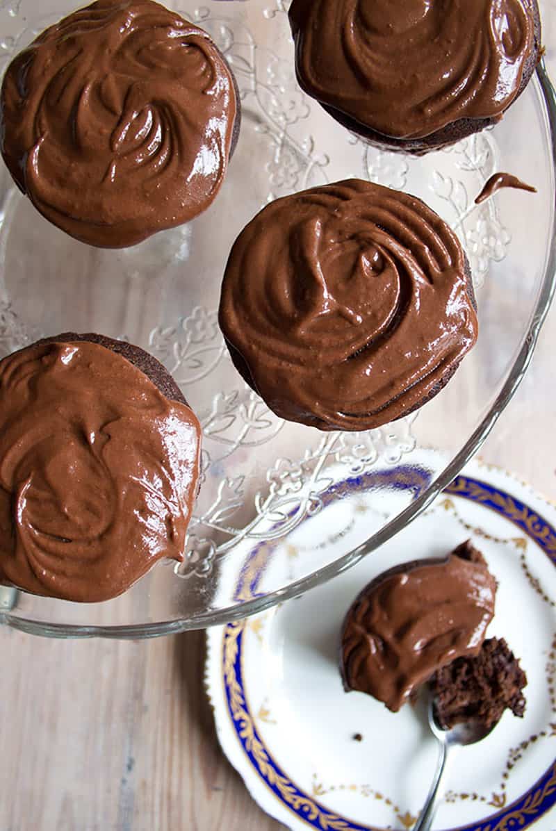 Gooey chocolate cupcakes on cake stand