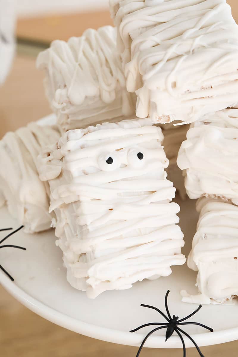 Mummy rice krispies treats on a cake stand.