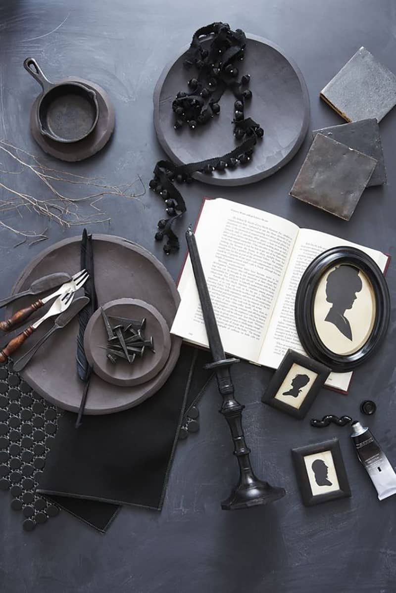 Black plates and a book for a spooky Halloween party ideas