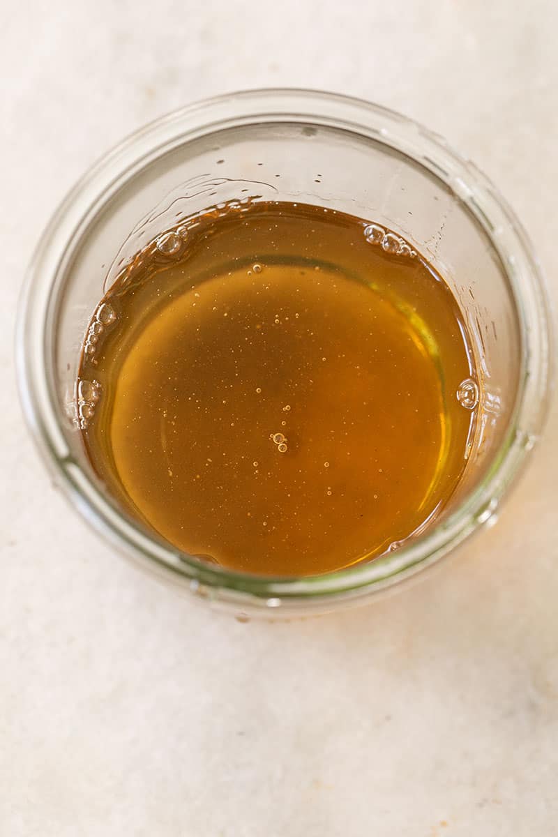 Simple syrup overhead in a glass jar. 