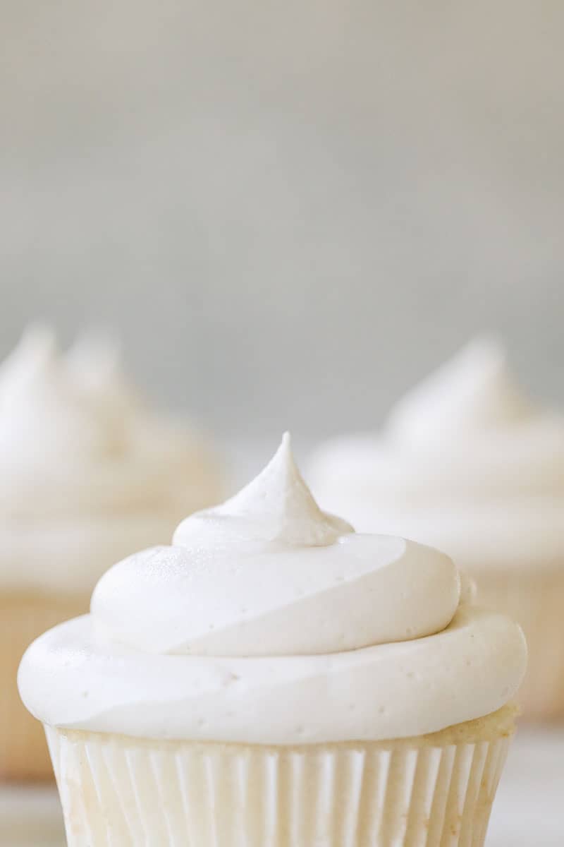 A cupcake topped with homemade buttercream frosting 