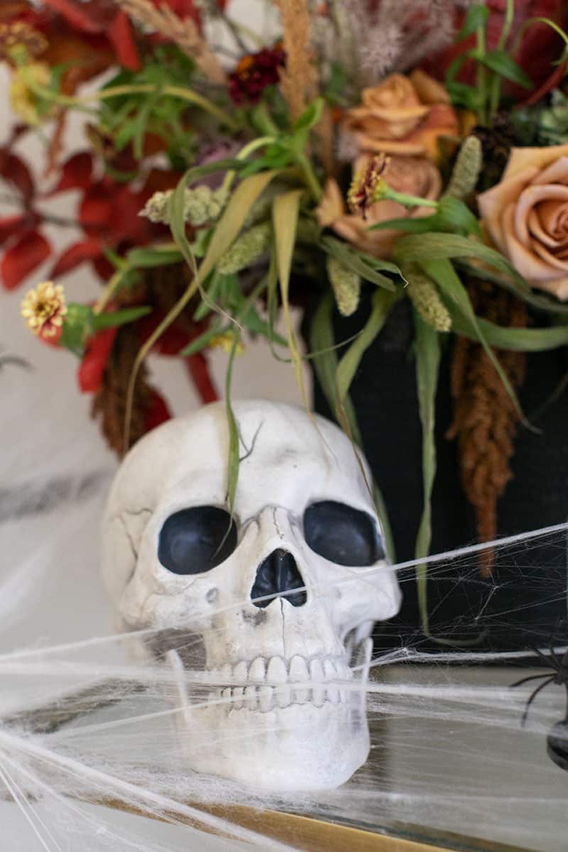 Halloween skull with spider webs - halloween decorations, festive halloween decorations, red acrylic paint, tea lights