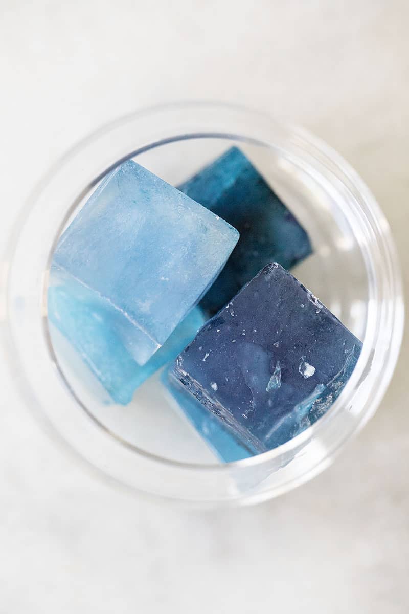 Naturally dyed blue ice cubes using butterfly pea flower. 