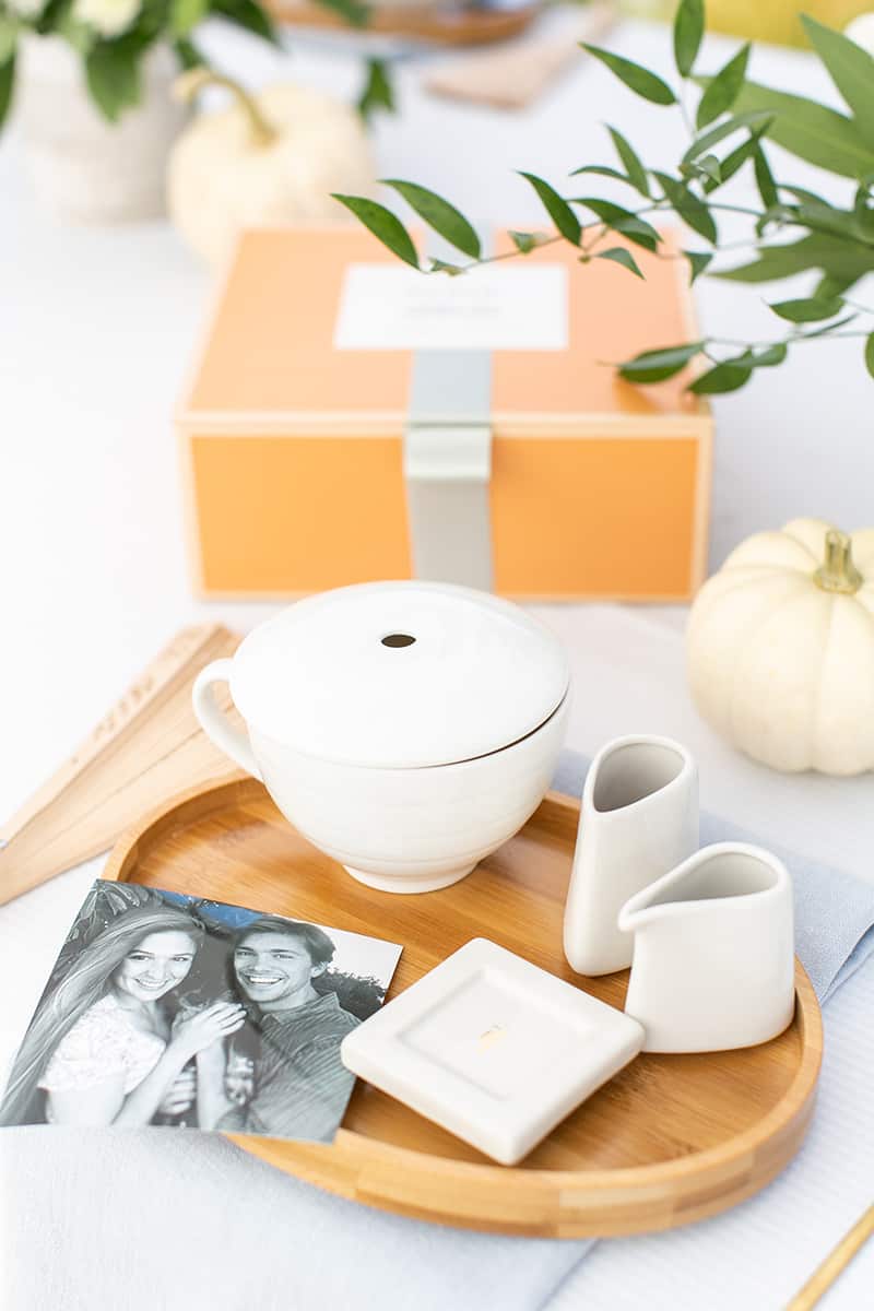 Bridal shower decorations with personalized photo and tea set.