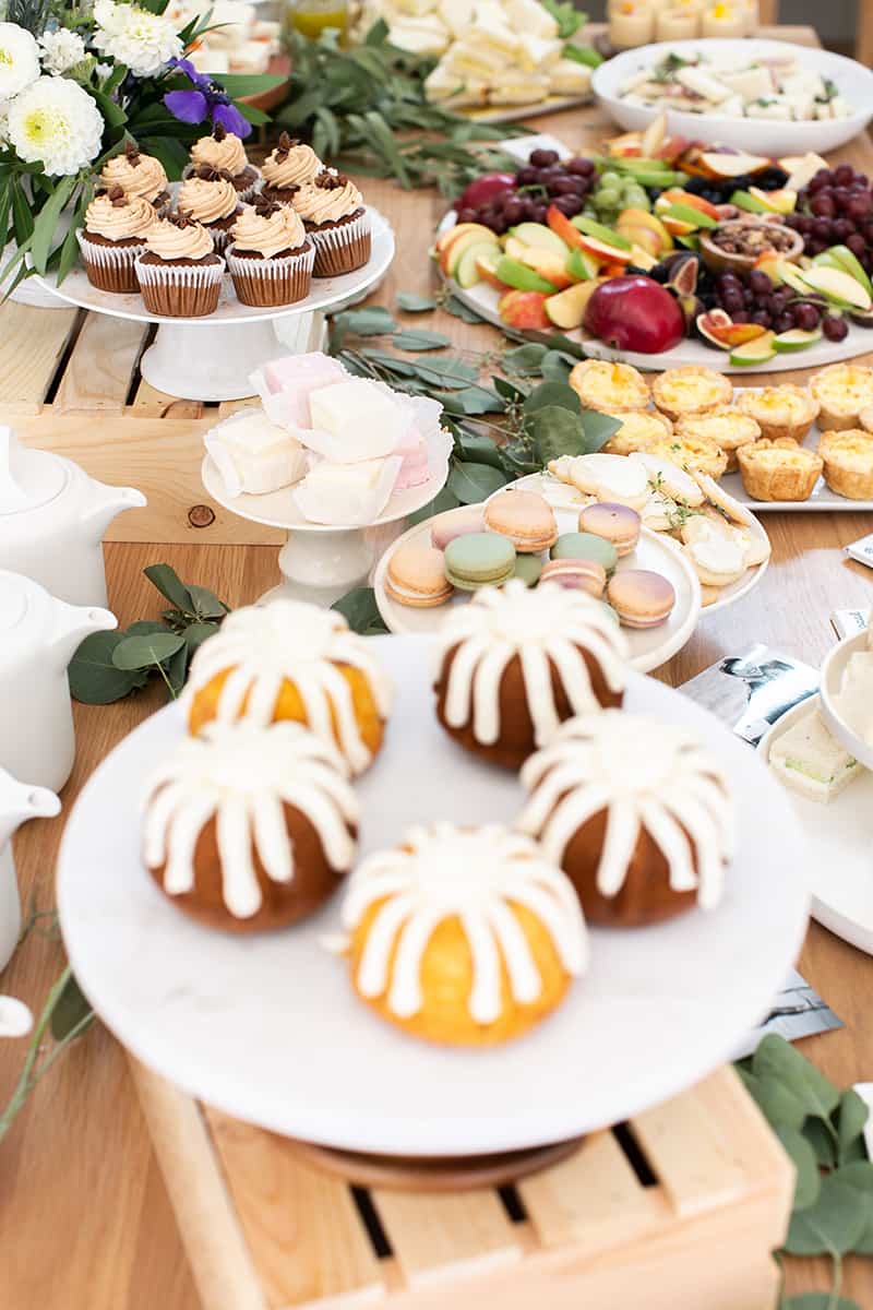 table filled with tea party bridal shower food.