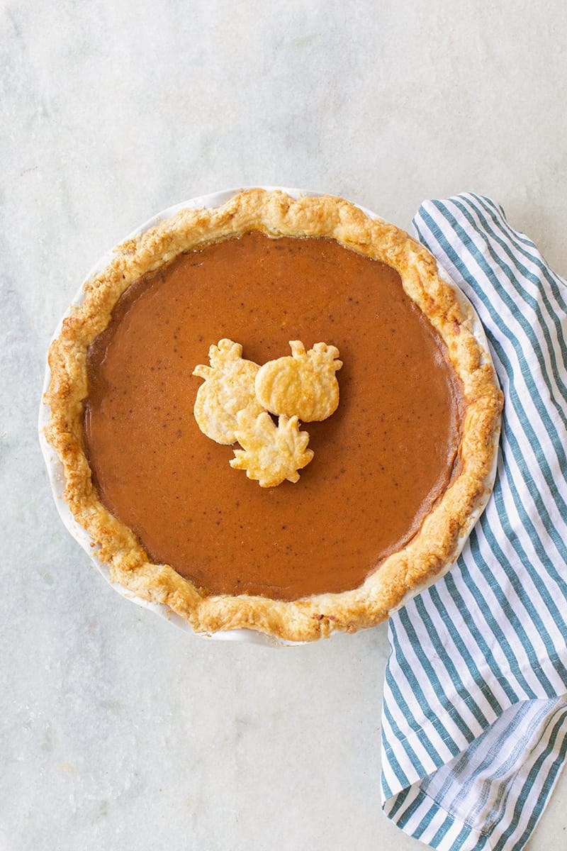 pumpkin pie on a marble table.